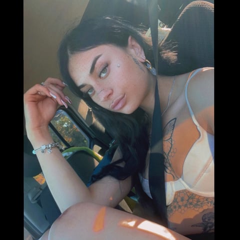 Tattooed, tanned babe with piercings and long b...