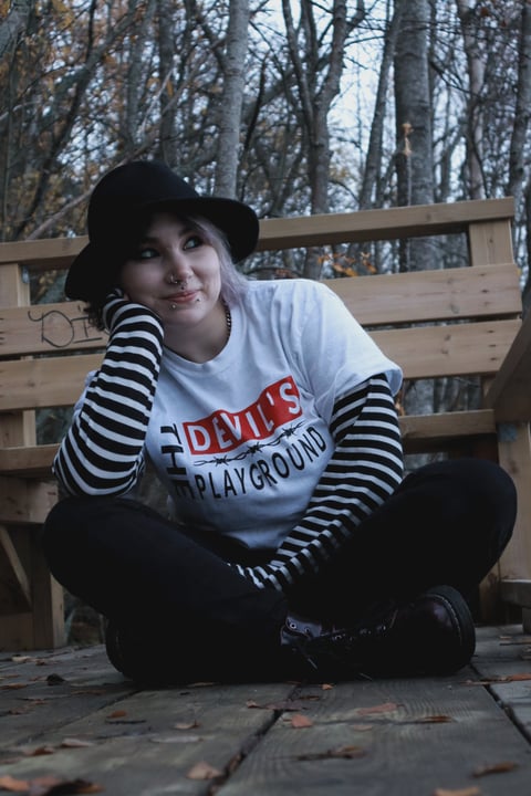 Alternative girl with tattoos and piercings.